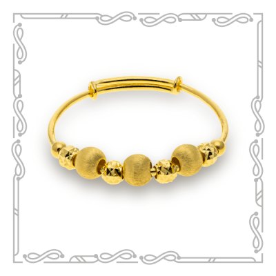 Gold bangle with beads